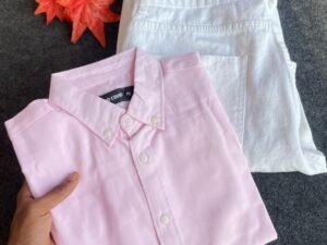 Soft Elegance: Pastel Pink Shirt with Crisp White Bottoms for Effortless Style