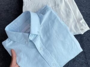 Effortless Summer Style: Classic Light Blue Shirt with Crisp White Shorts