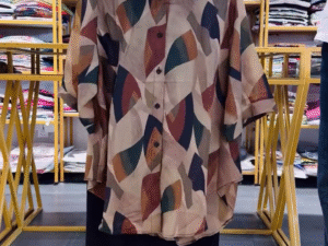 Earthy Street Style: Abstract Printed Shirt with Classic Black Shorts